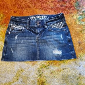 Express distressed denim miniskirt with studs.